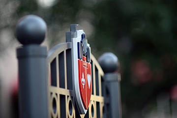 University Crest on the top of a sign
