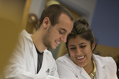 Male and Female student working in lab
