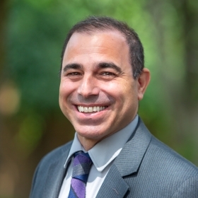 A portrait photograph of Luis Manzo