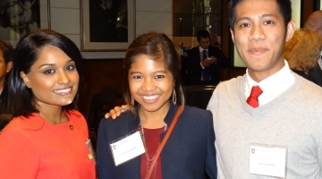Three alumni posing for photo