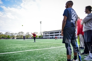 Students playing a game of softball