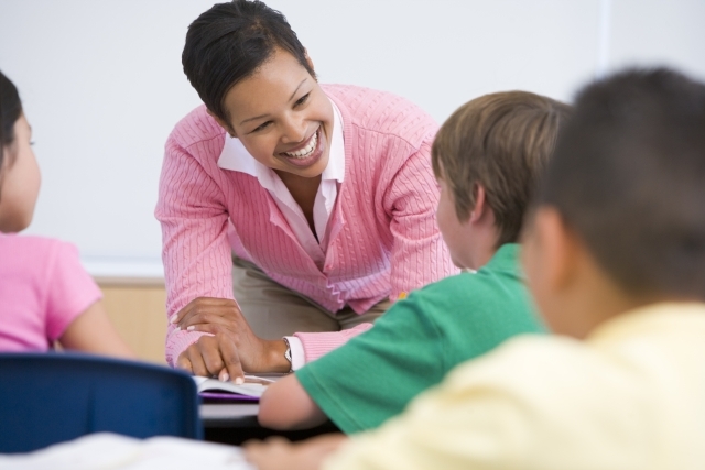 Elementary School teacher with students