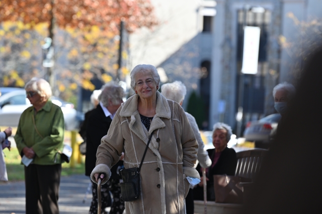 Female in a winter coat walking towards the camera