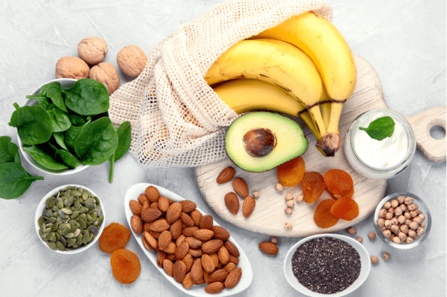 A tablescape of different healthy snacking options such as fruits and nuts