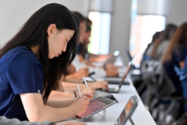 Students sitting at table in St. Vincent Health Sciences Center classroom