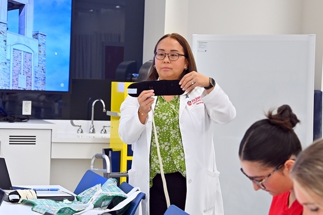 Faculty member teaching inside St. Vincent Health Sciences Center classroom