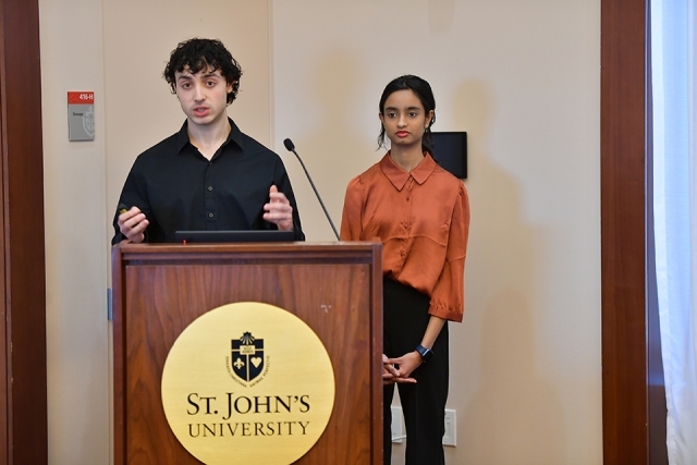 Students speaking at podium