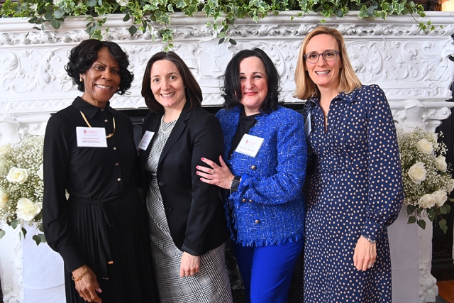 Four attendees posing for photo at the 14th Annual Leaders in Education Awards Dinner