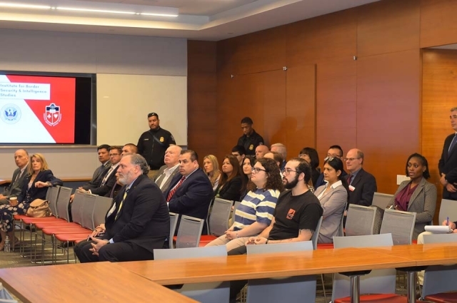 People seated in rows of chairs