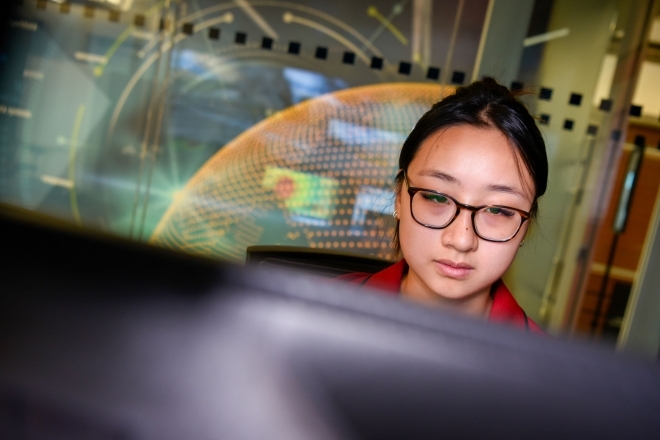 Female student looking at computer monitor